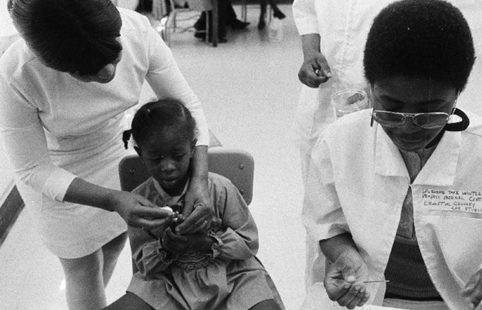 Physician is conducting sickle cell testing on a child